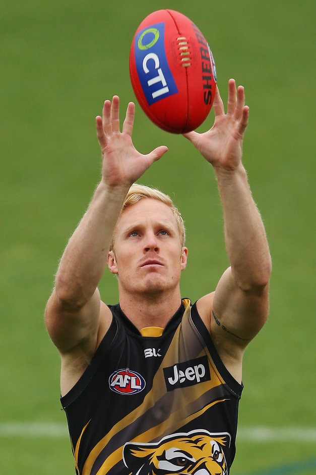 AFL 2016 Training - Richmond 170216 MELBOURNE, AUSTRALIA - FEBRUARY 17: Steven Morris of the Tigers marks the ball during a Richmond Tigers AFL media session at Punt Road Oval on February 17, 2016 in Melbourne, Australia. (Photo by Michael Dodge/Getty Images/AFL Media)